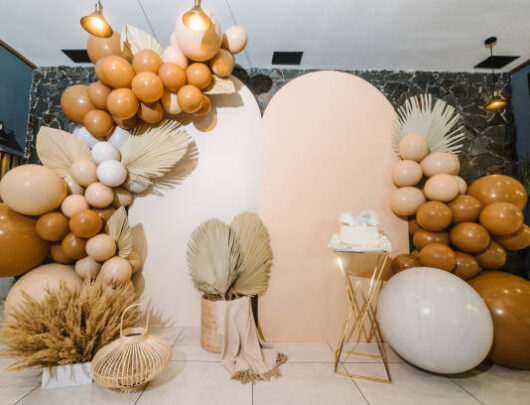 Birthday Cake on a background balloons party decor. Copy space. Trendy Cake. Delicious wedding reception. Celebration baptism concept. Trendy autumn decor.